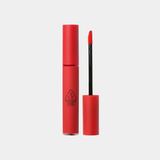 3CE Velvet Lip Tint with applicator, in a bright red color.